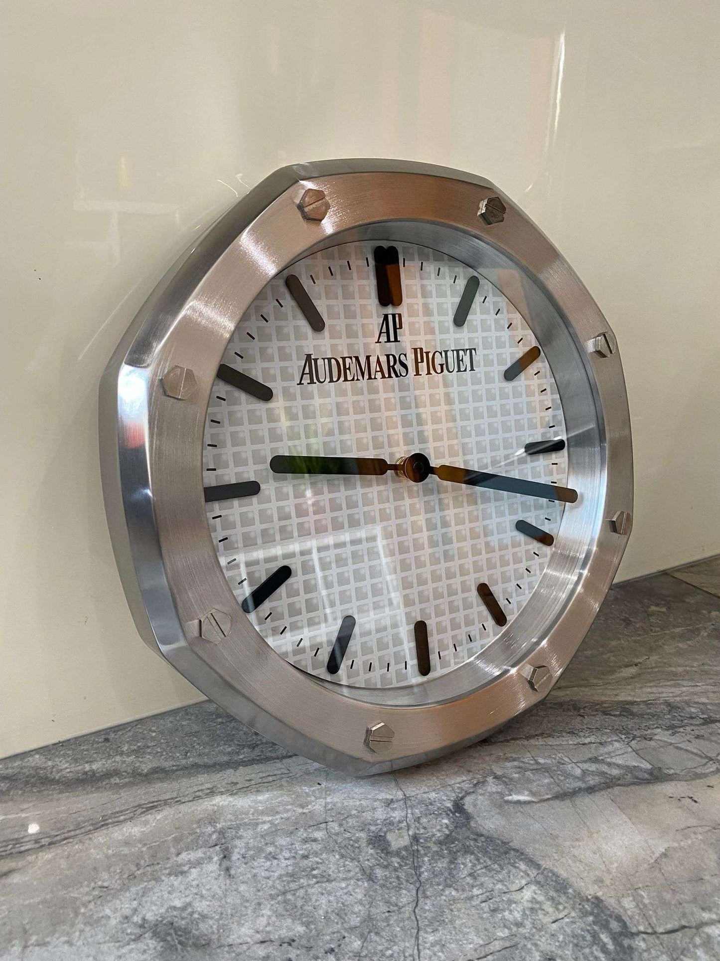 Luxurious stainless steel wall clock based on silver bezel and white face and black dial